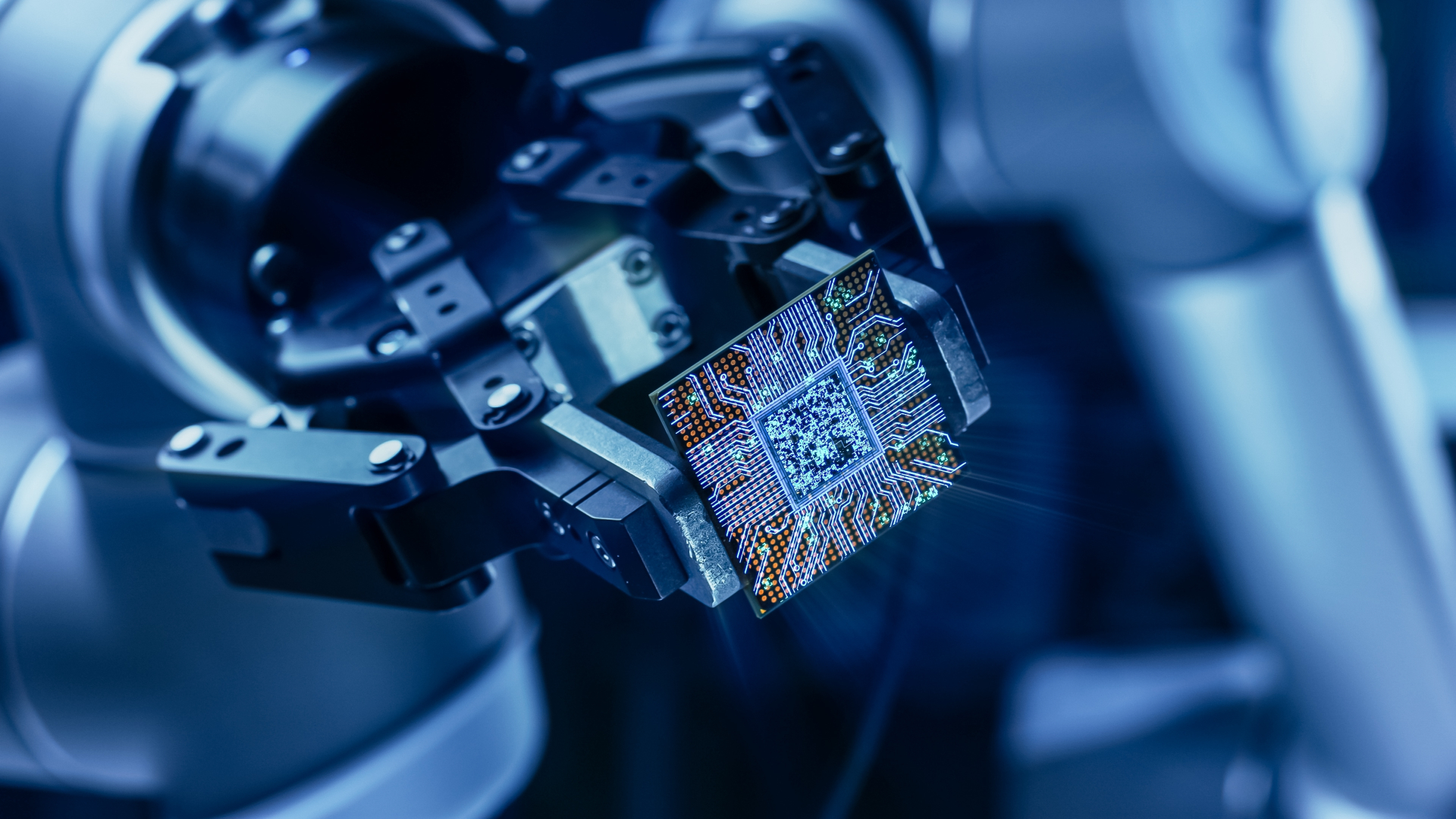 Quantum processor chip held by robotic precision equipment